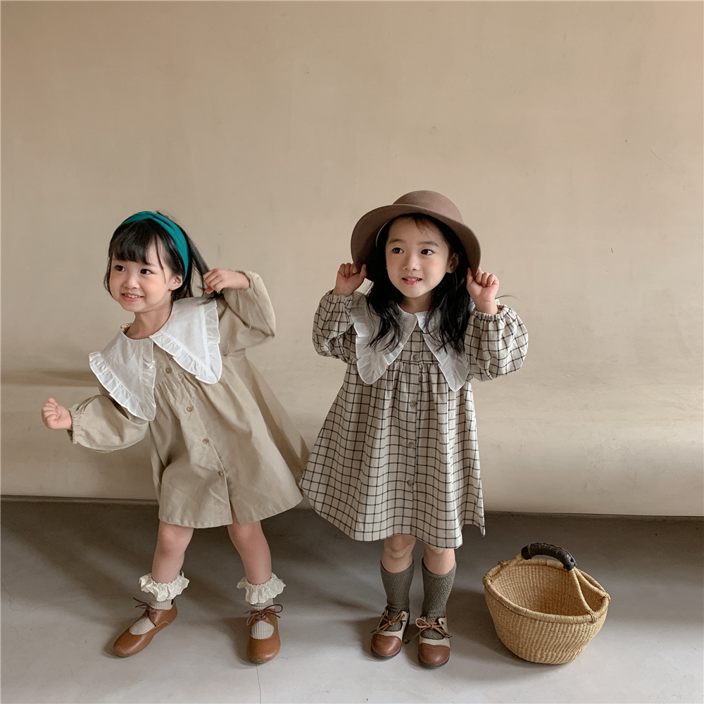 新しい2022年春の子供服のスカートの韓国版綿のリネンレース襟格子縞のスカート薄片の女の子のドレス