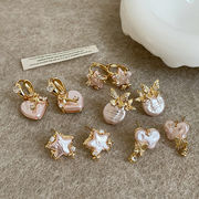 かわいいピンクのハート型と星型の真珠のリボンのイヤリング、流行の女性のイヤリング