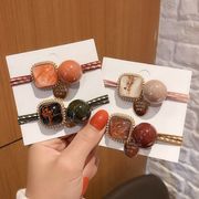 ヘアゴム ゴールドプレート付きビッグビーズとウイズグラスチャームの2連結びヘアゴム